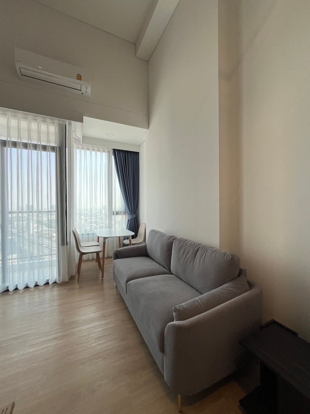 Siamese Rama 9 1BR — glass-partition bedroom, city outlook photo 1