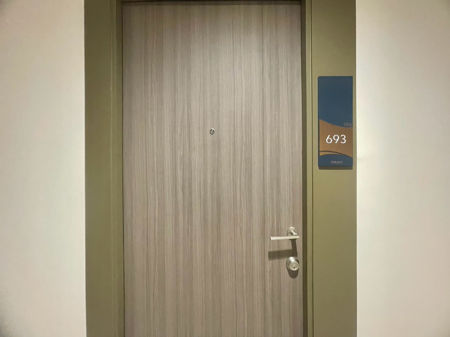 Glass-partition bedroom, warm wood — Life Ladprao Valley