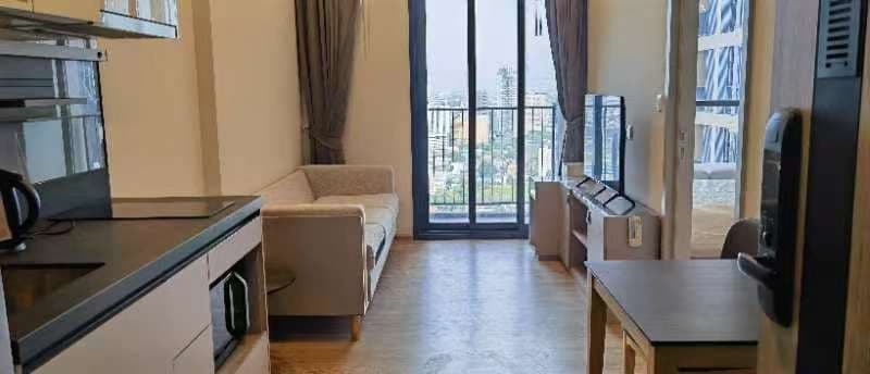 Open-view balcony over low-rise Bangkok — Oka Haus photo 1