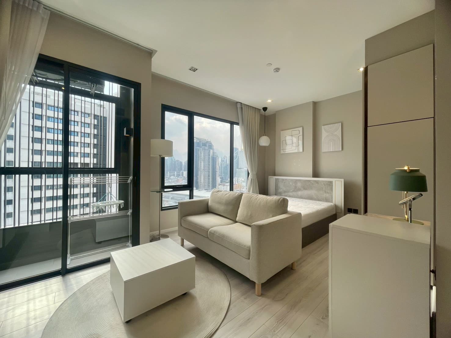 Skyline window right beside the bed — The Room Phayathai
