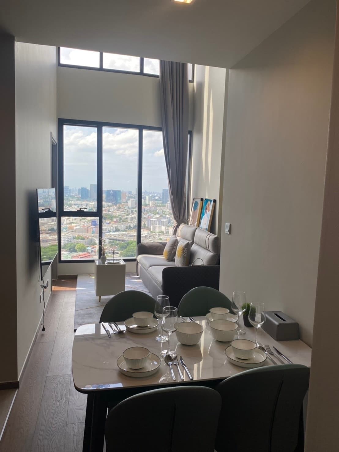High-floor duplex, city-view dining — IDEO Q Victory